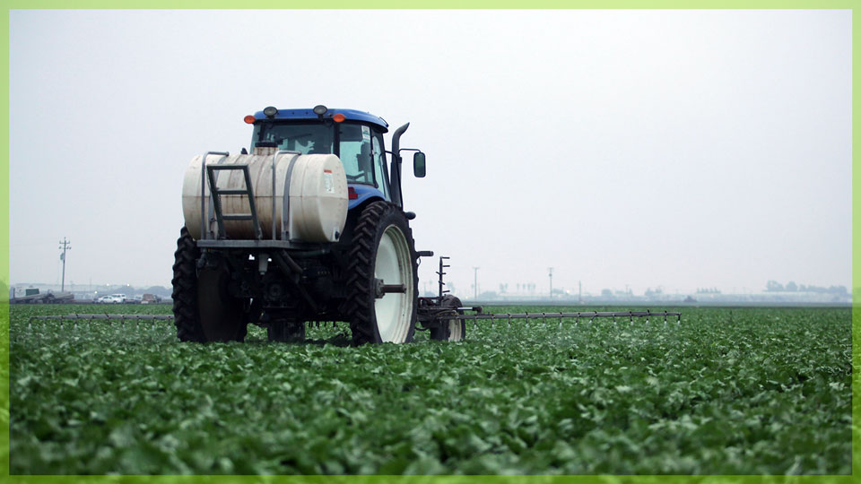 tractor in green field